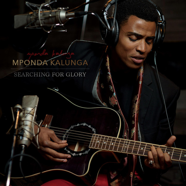 Mponda plays guitar